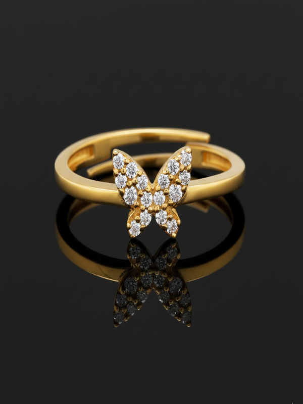 Gold butterfly ring with diamond accents on a black background